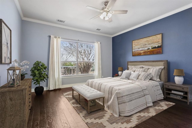 bedroom with baseboards, visible vents, wood-type flooring, and ornamental molding