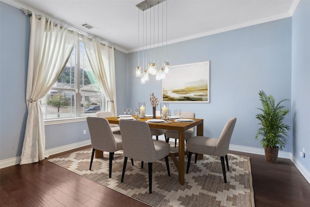 606 Anfield Cir, Austin, TX 78738 - dining area with wood finished floors and crown molding