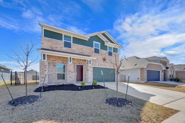 view of front facade with a garage, driveway, and fence