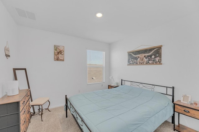 bedroom with light carpet, baseboards, and visible vents