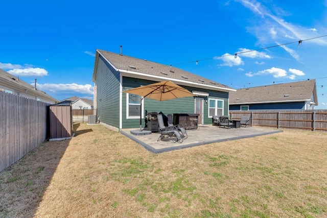 rear view of house featuring a yard, cooling unit, a fenced backyard, and a patio