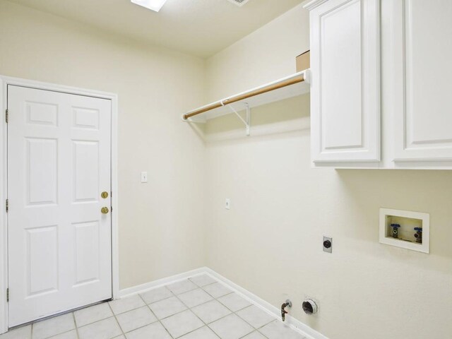 laundry area with cabinet space, baseboards, gas dryer hookup, hookup for a washing machine, and hookup for an electric dryer