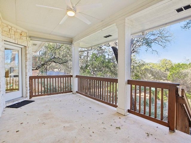 deck featuring a patio area, ceiling fan, and visible vents