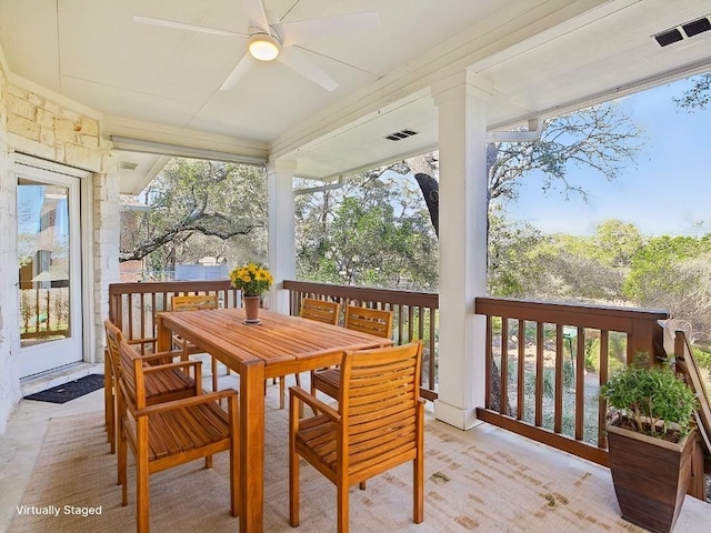 exterior space featuring a ceiling fan, outdoor dining area, and visible vents