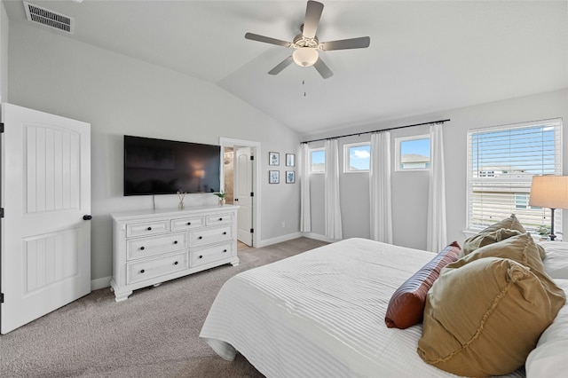 bedroom with light carpet, baseboards, visible vents, and vaulted ceiling