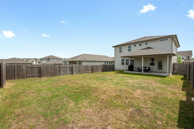 back of property featuring a patio area, a lawn, and a fenced backyard