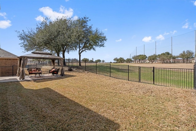 view of yard with a patio area, fence, and a gazebo