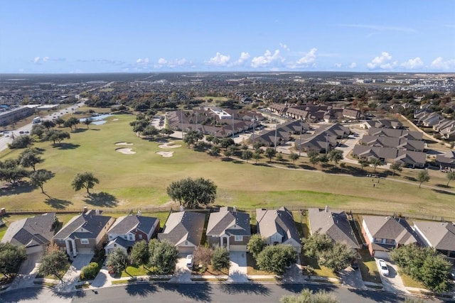 drone / aerial view featuring a residential view and golf course view