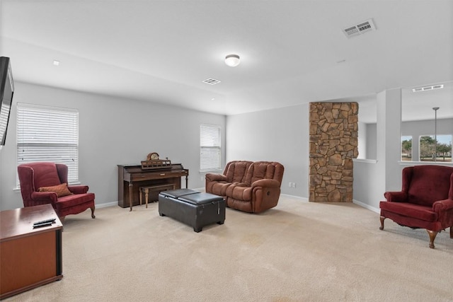 living room featuring carpet flooring and visible vents