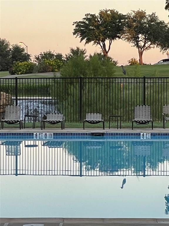 community pool with fence