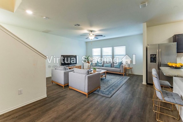 470 Major Lee Ln, Jarrell, TX 76537 - living area featuring dark wood-type flooring, baseboards, visible vents, and ceiling fan