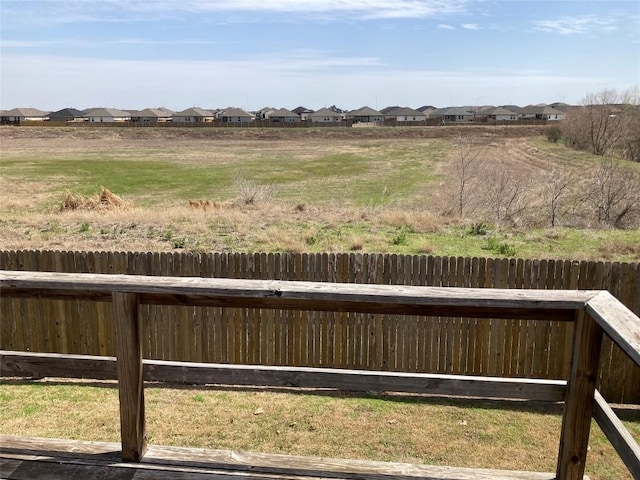 view of yard featuring a residential view and fence