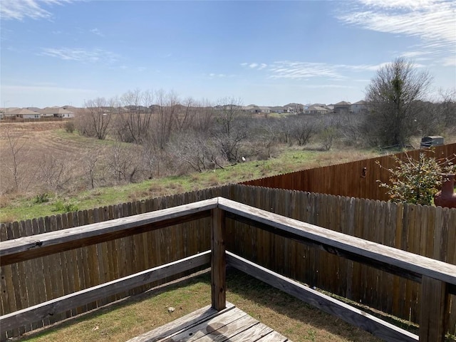 deck with a fenced backyard