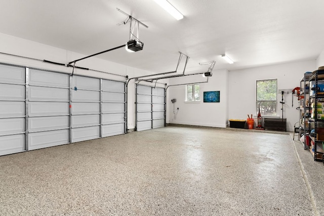 garage featuring a garage door opener