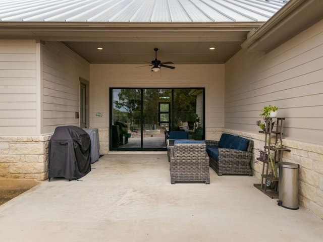 view of patio featuring ceiling fan, a grill, and an outdoor living space