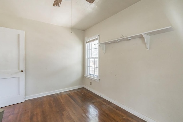 spare room with ceiling fan, baseboards, and wood finished floors