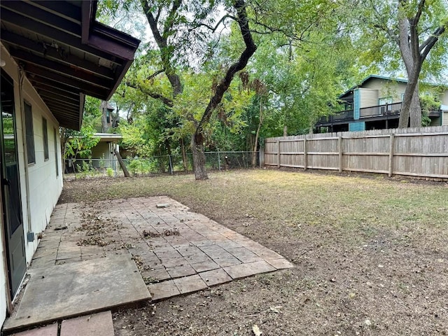 view of yard featuring a fenced backyard and a patio