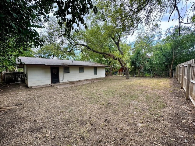 view of yard with a fenced backyard