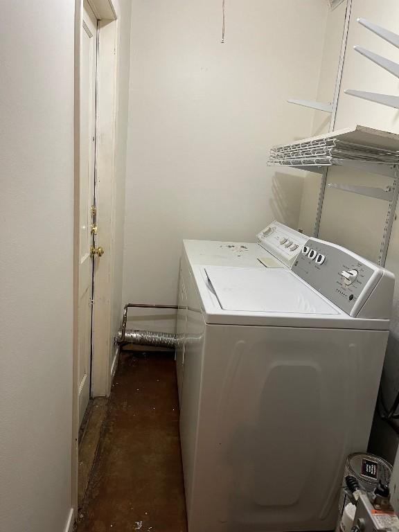 clothes washing area with laundry area and washing machine and clothes dryer