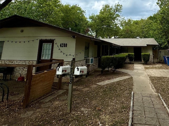 exterior space featuring stone siding