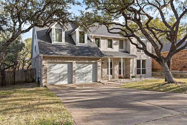 view of front of property with a garage, driveway, fence, and roof with shingles