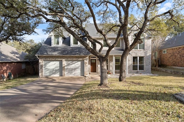 view of front of house featuring a garage, a shingled roof, concrete driveway, a front lawn, and brick siding