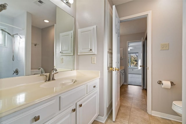 full bathroom featuring toilet, visible vents, baseboards, vanity, and tile patterned floors