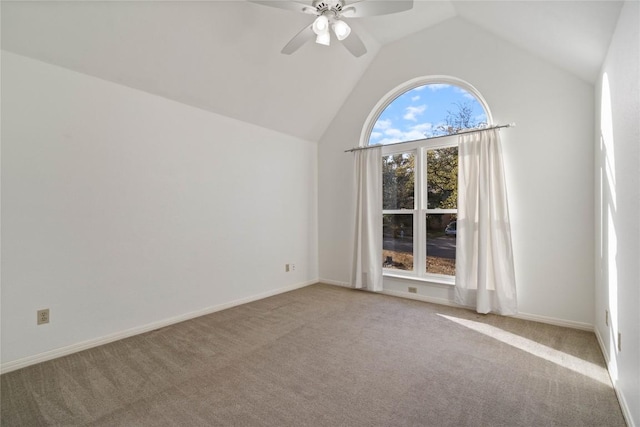 unfurnished room with high vaulted ceiling, carpet flooring, baseboards, and a ceiling fan