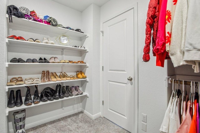 spacious closet with carpet flooring