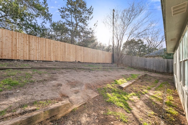 view of yard with a fenced backyard