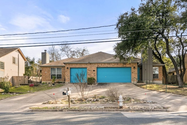 view of front of property featuring an attached garage, brick siding, fence, driveway, and a chimney