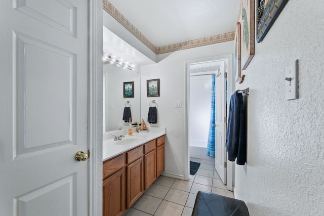 bathroom with shower / washtub combination, tile patterned flooring, and vanity