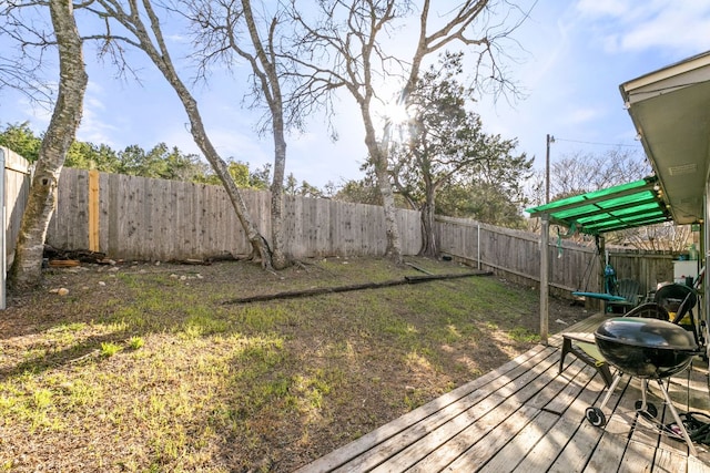 view of yard with a fenced backyard and a wooden deck