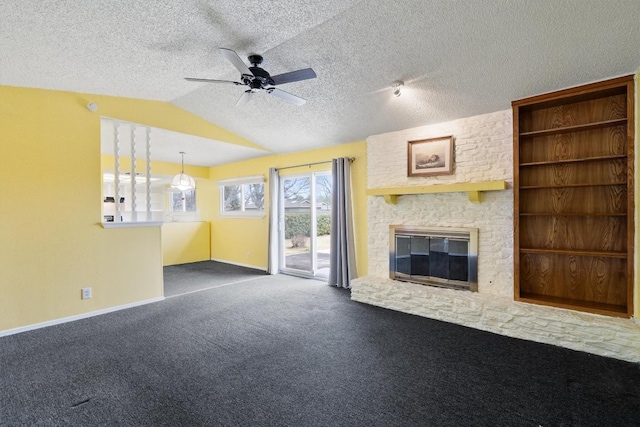 unfurnished living room with lofted ceiling, a textured ceiling, carpet floors, baseboards, and a brick fireplace