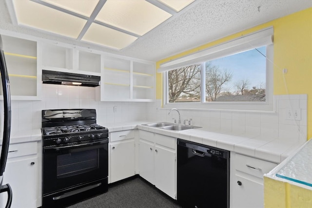 kitchen featuring under cabinet range hood, open shelves, a sink, white cabinets, and black appliances