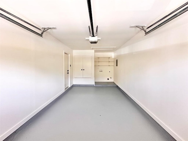 garage featuring baseboards and a garage door opener