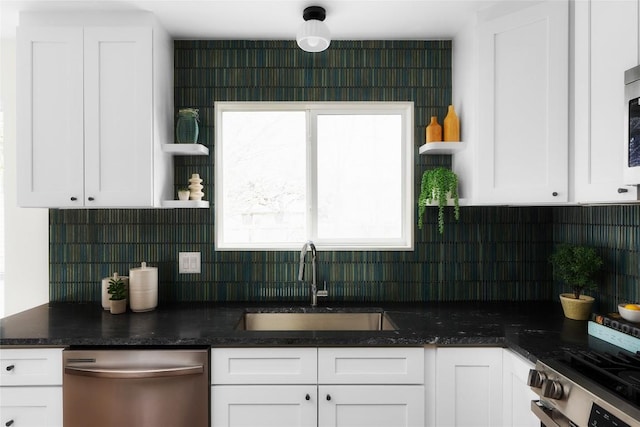 kitchen featuring a sink, open shelves, appliances with stainless steel finishes, white cabinets, and decorative backsplash