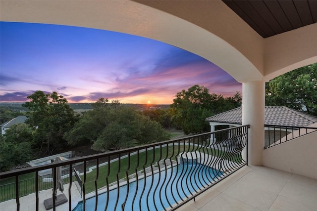 view of balcony at dusk