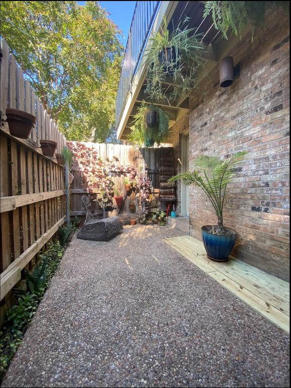 view of yard featuring a patio and fence