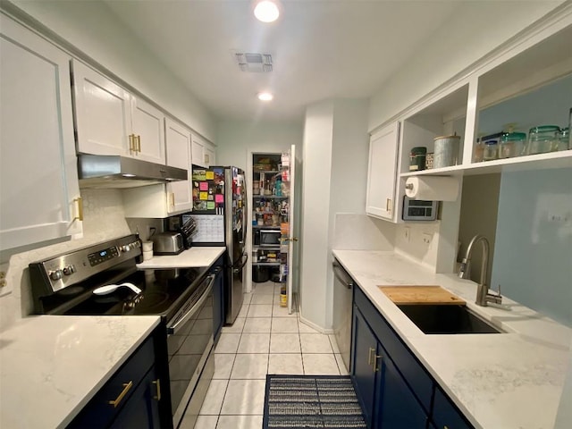 kitchen with stainless steel appliances, visible vents, white cabinetry, a sink, and under cabinet range hood