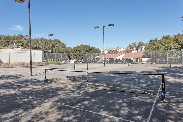 view of sport court with fence