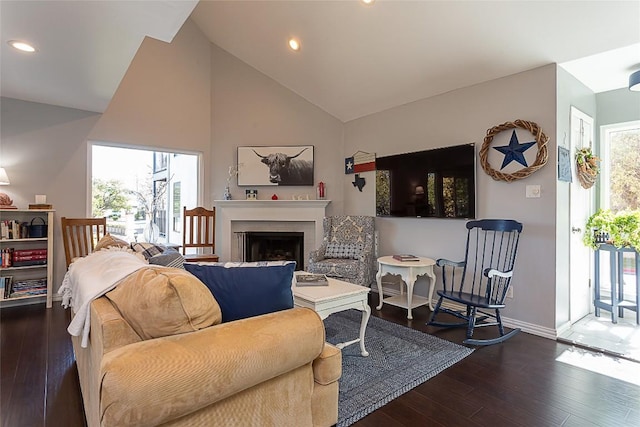 living room with recessed lighting, baseboards, a fireplace, and dark wood-style flooring