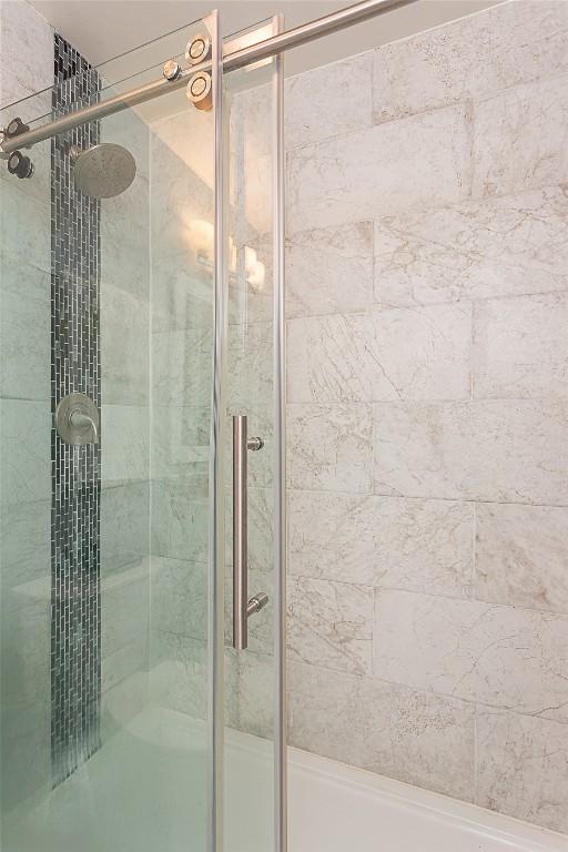 full bath with a shower stall