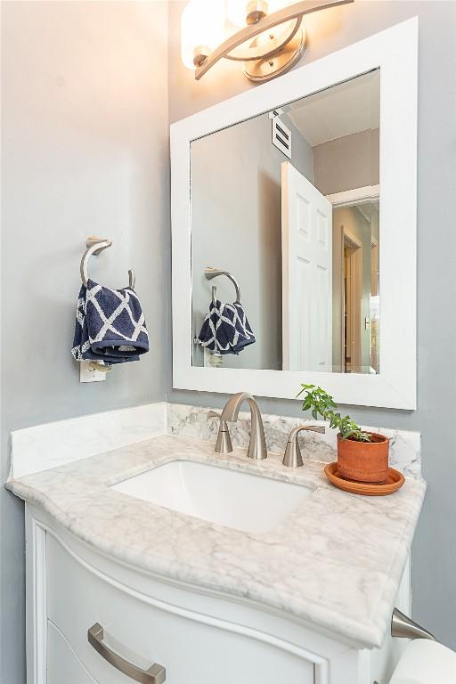 bathroom featuring vanity and visible vents