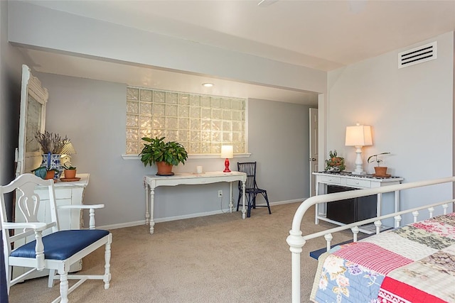 bedroom with visible vents, baseboards, and light colored carpet