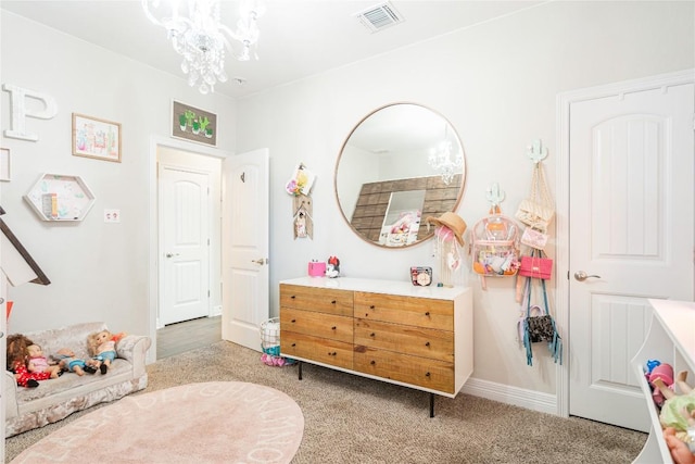 recreation room featuring carpet, visible vents, a notable chandelier, and baseboards