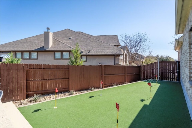 view of yard with a fenced backyard