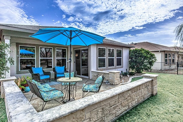 view of patio / terrace with outdoor lounge area and fence