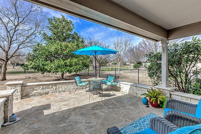 view of patio / terrace featuring fence