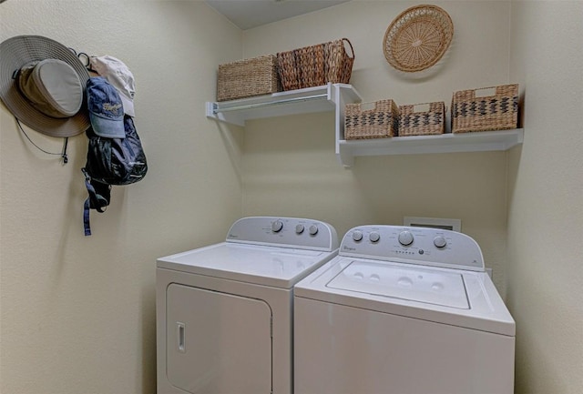 washroom featuring laundry area and washer and dryer